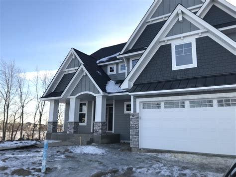 dark gray house with metal roof accent|gray house exterior colors.